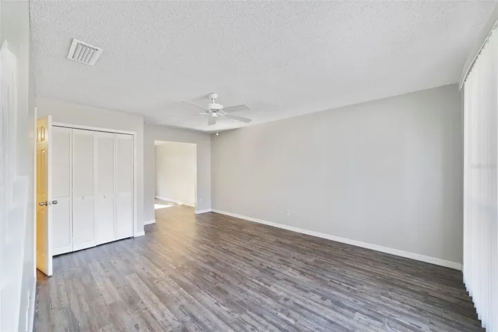 Step inside to find LUXURY VINYL PLANK FLOORING throughout and a bright, welcoming Living Room where a large picture window fills the space with NATURAL LIGHT and a stylish ceiling fan keeps the room comfortable all year long.