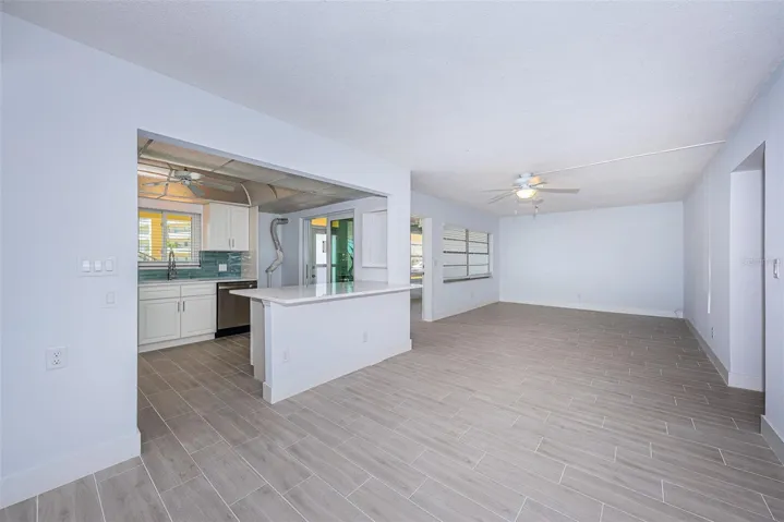 Dining room and Living room showing kitchen and breakfast bar.