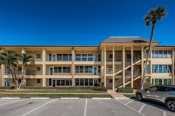 Front of building showing #110 parking space and this unit comes with a carport too.