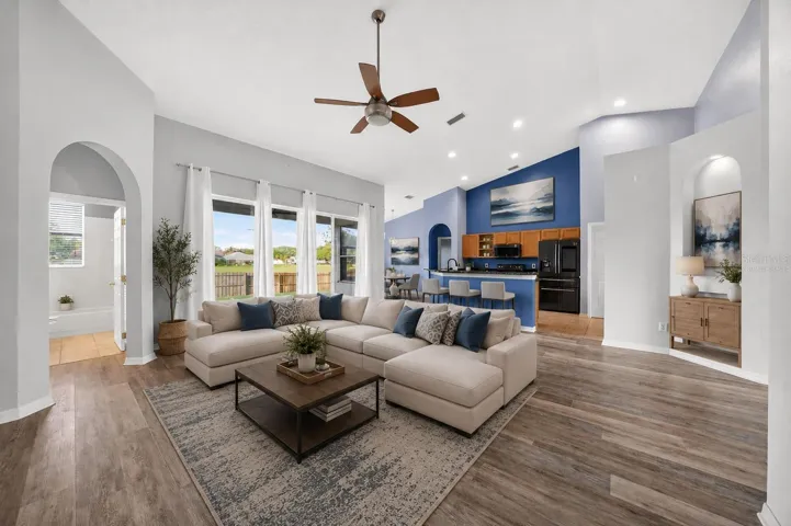 Virtually staged opened family/kitchen perfect for entertaining
