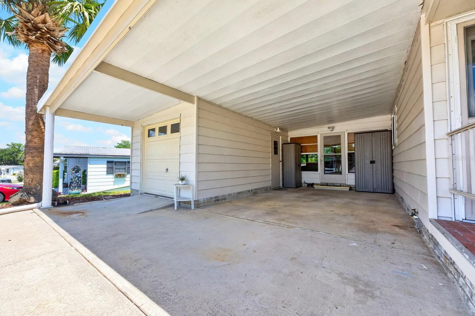 Garage and additional covered parking.