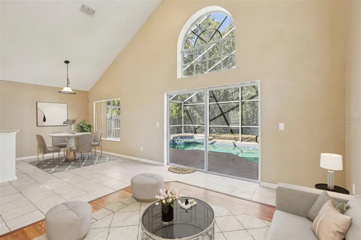 Light filled two story family room, breakfast nook. Virtually Staged.
