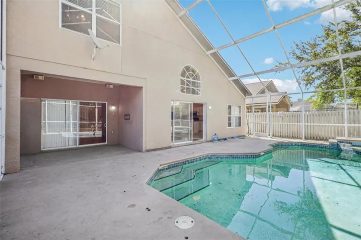 Covered lanai overlooks the pool.