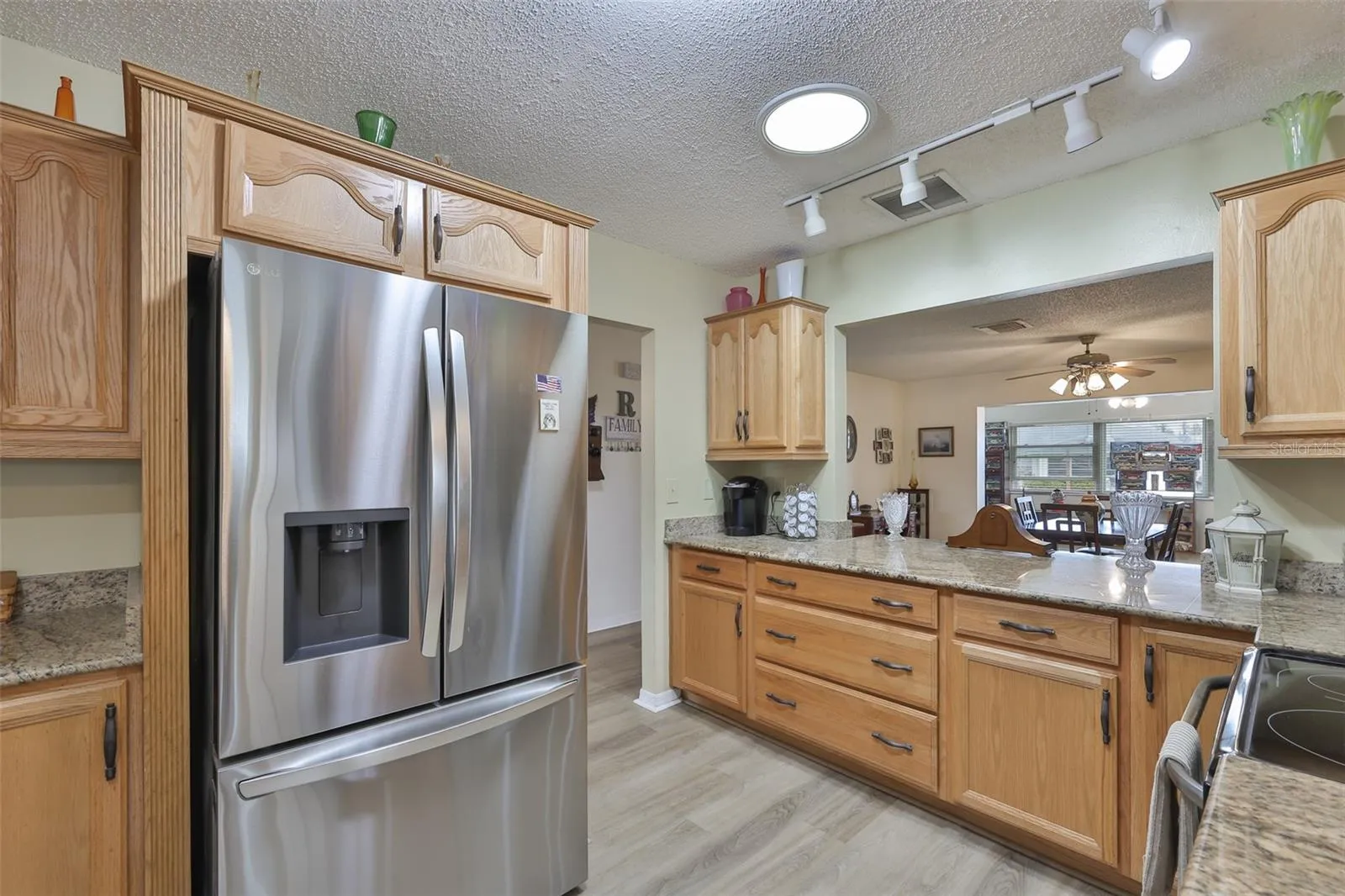 Granite Countertops, Breakfast Bar, Ample Wood Cabinets