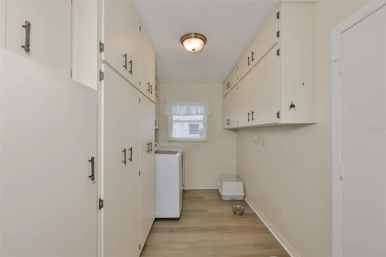 Oversized Laundry Room, Plenty of Storage Cabinets