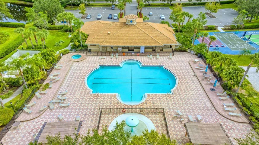 Community Pool with Views of Clubhouse, Spa, Splash Pad, Shuffleboard, Corn Hole and Bocce Ball Courts