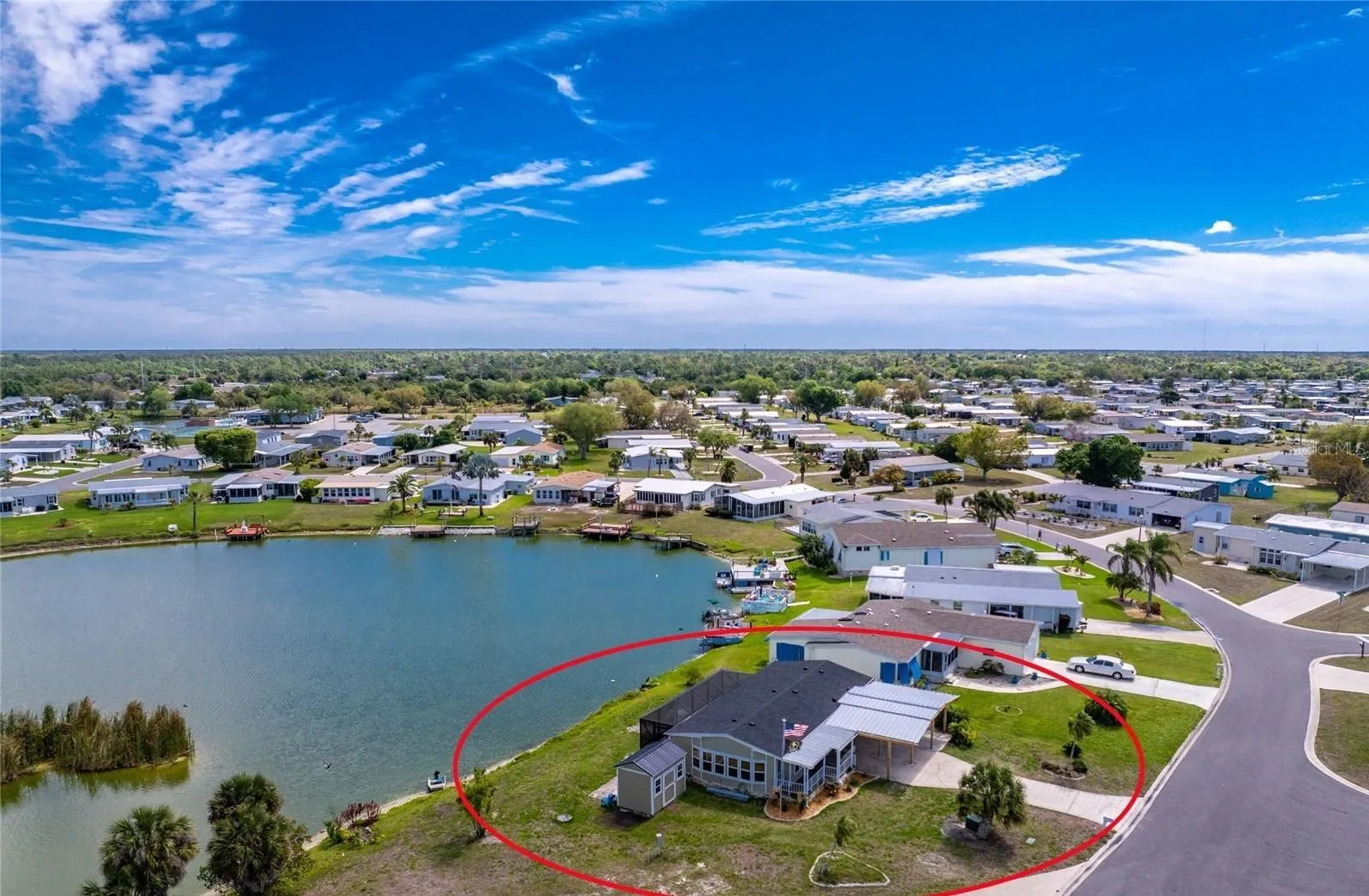 Rarely available almost 100' on the Lake with a 3 Bay Carport For all your Toys