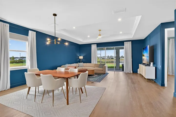 Kitchen with open floor plan, a kitchen breakfast bar, plenty of natural light