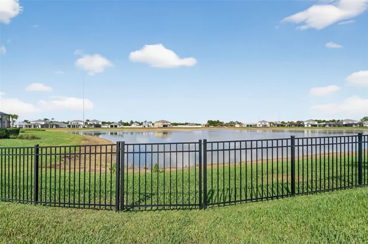 West facing water view fenced backyard.