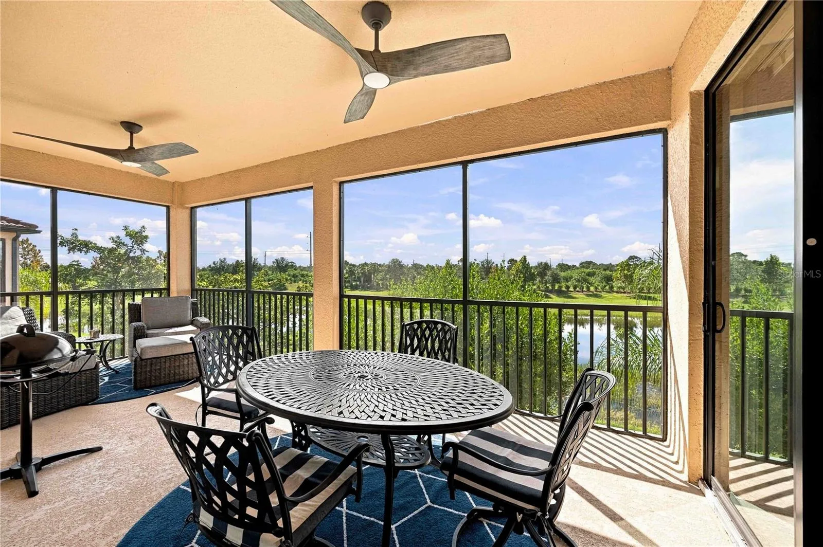 Lanai has dining table, grill and lounge area