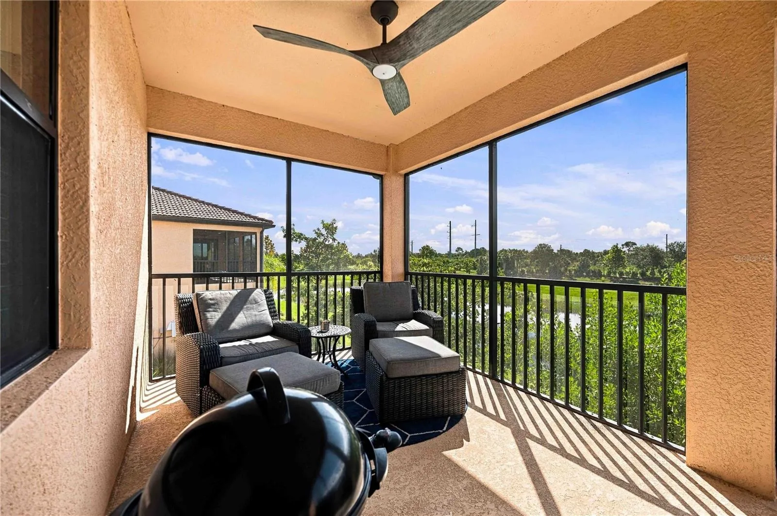 Lanai has dining table, grill and lounge area
