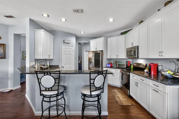 Stone counters, 42 inch cabinets and stainless steel appliances