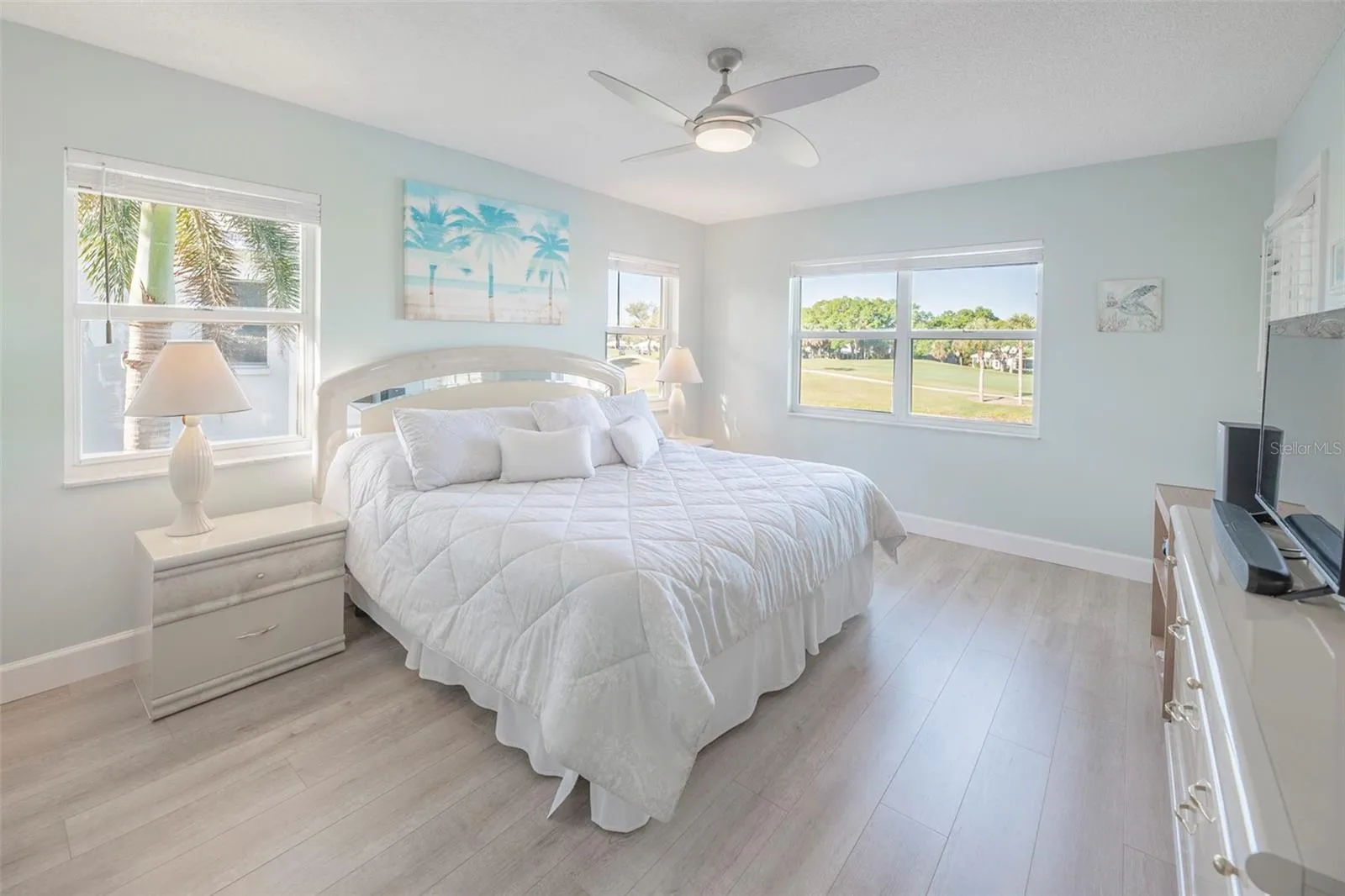 Primary bedroom with view of the golf course and of the water.