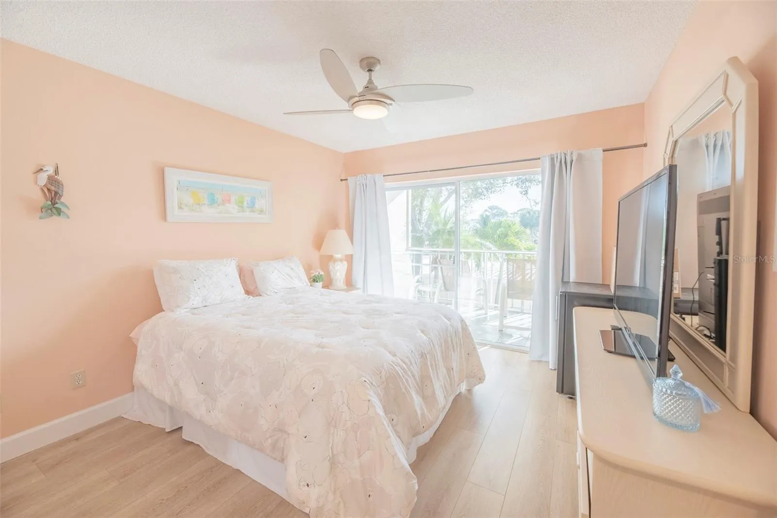 Second bedroom or guest room with private balcony.