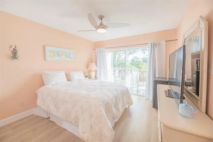 Second bedroom or guest room with private balcony.