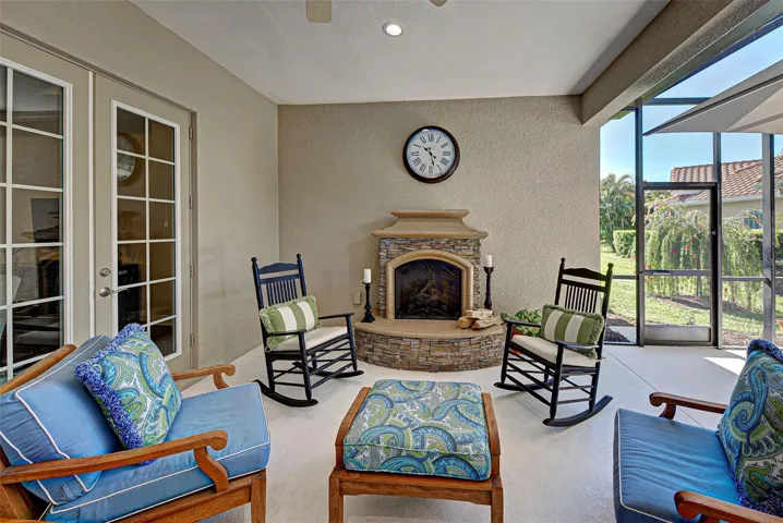 Spacious outdoor area has 2 covered areas!  Unwind with family or friends by the stone, propane gas fireplace (120 propane tank leased).