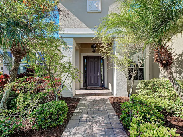 Welcoming, covered front entrance greets you.  Front door and windows are hurricane proof too.