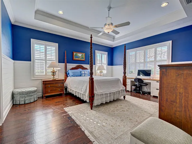 Sumptuous primary suite is a true retreat!  Plantation shutters and detailed woodwork add class.