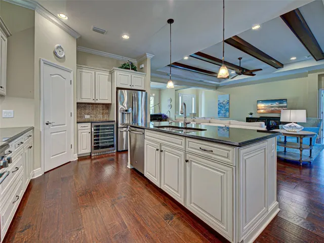 Large island offers more prep and storage space.  Bonus:  kitchen sink has reverse osmosis.