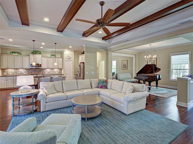 Classy great room seamlessly flows to gourmet kitchen and dining room, making entertaining a breeze.