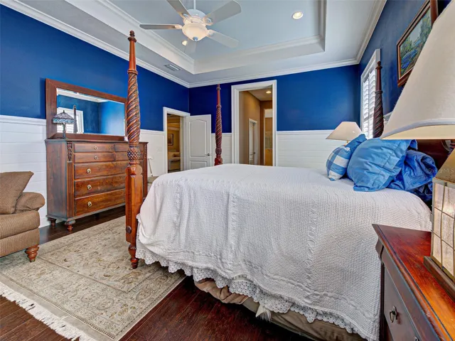 Primary suite has 2 walk-in closets with custom shelving and an ensuite bathroom.