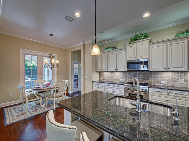 Another view of the kitchen which flows to the dinette, lanai and den.