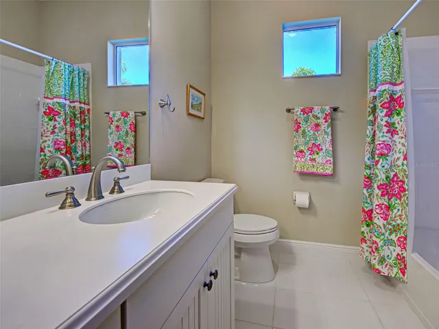 2nd full bathroom with tub/shower combination - just right for guests.