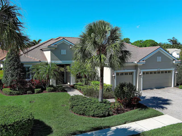 Spectacular home has a 3 CAR GARAGE, lovely paver walkway and driveway, fresh exterior paint, outdoor lighting and lush landscaping - what wonderful curb appeal.