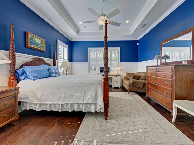 Tray ceiling makes the room feel large while the many windows let the natural light in.