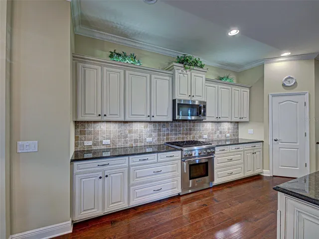 The kitchen has so much storage and prep space, along with under and upper cabinet lighting, soft close drawers and pantry.