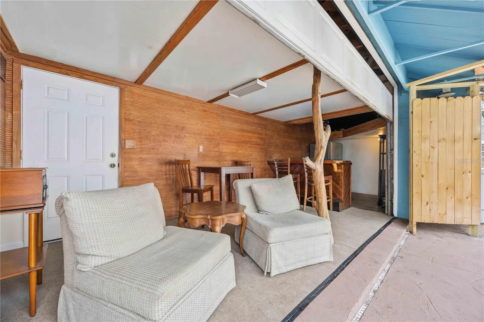 Bar area off the lanai features an overhead door that locks for added security.