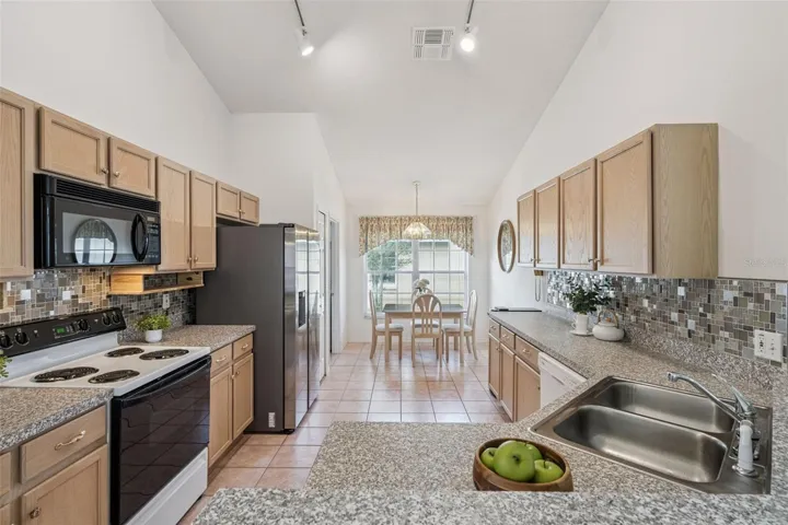 Open Concept Kitchen with bartop, Stainless Steel Appliances