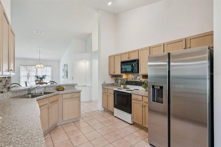 Open Concept Kitchen with bartop, Stainless Steel Appliances