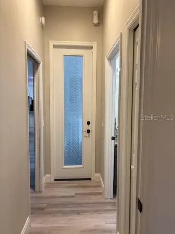 door leading to pool from private guest room hall way