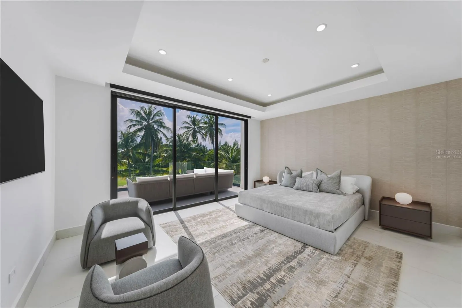 Guest Bedroom - The terrace that connects to the bedroom in this image has been virtually staged and does not reflect the current state of the property.
