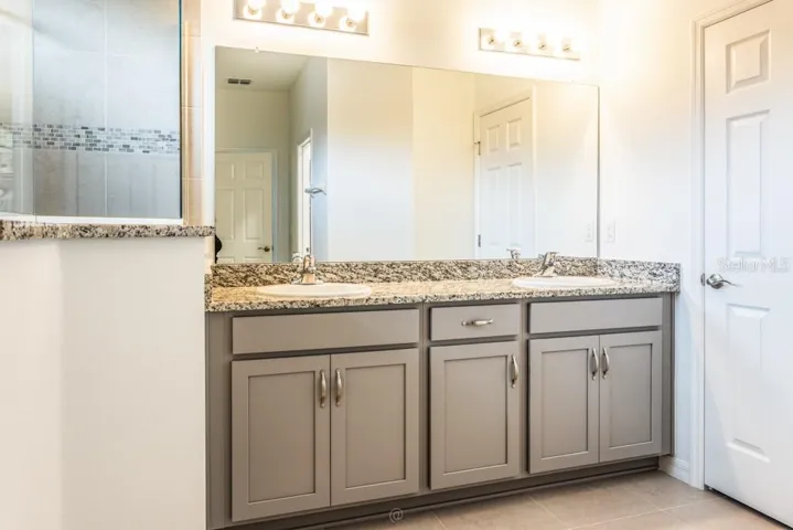 primary bathroom with spacious linen closet