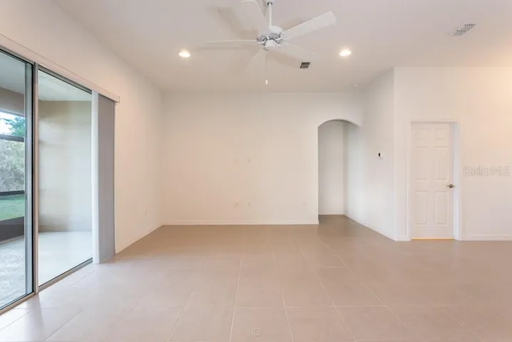 Living room with glass sliders to rear porch