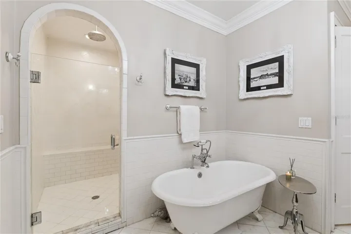 Primary bath with claw foot tub and oversized shower