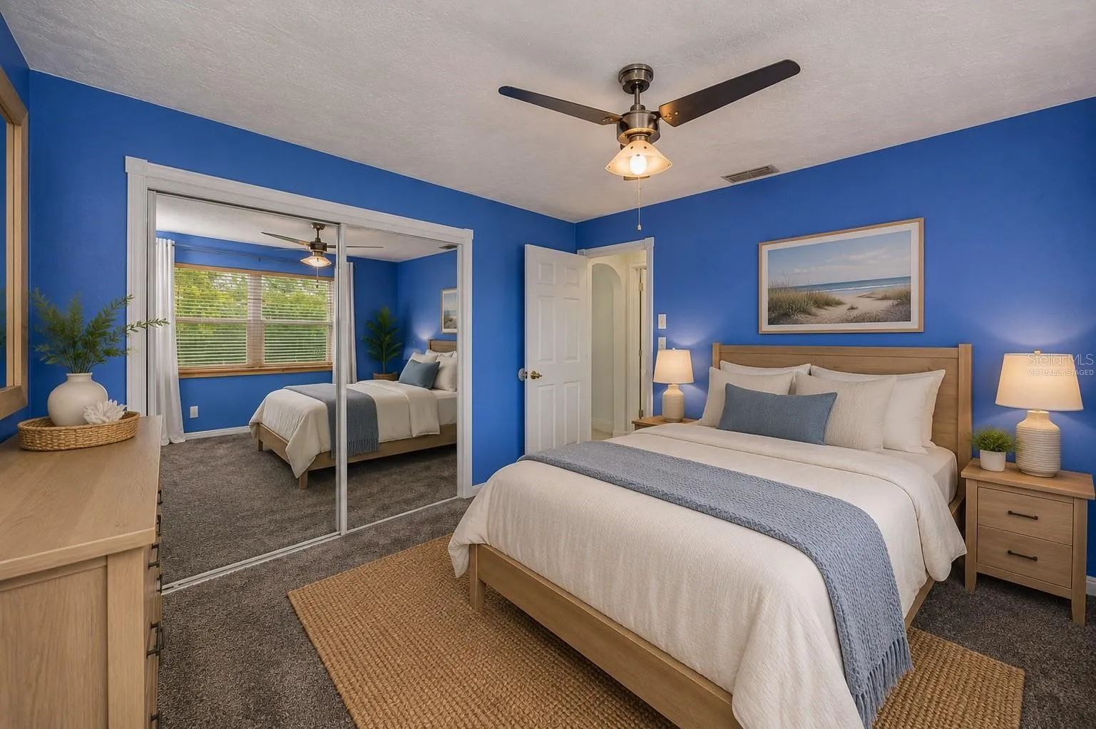 Virtually Staged Second Bedroom features Mirrored Closet.