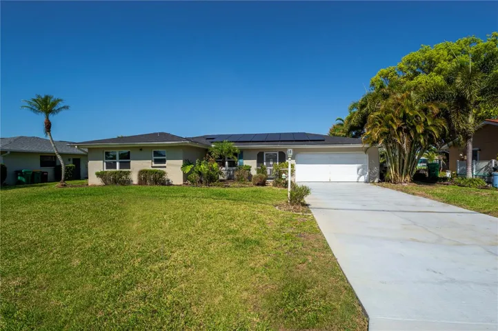 Canal-Front Living with Heated Pool and Solar Savings.