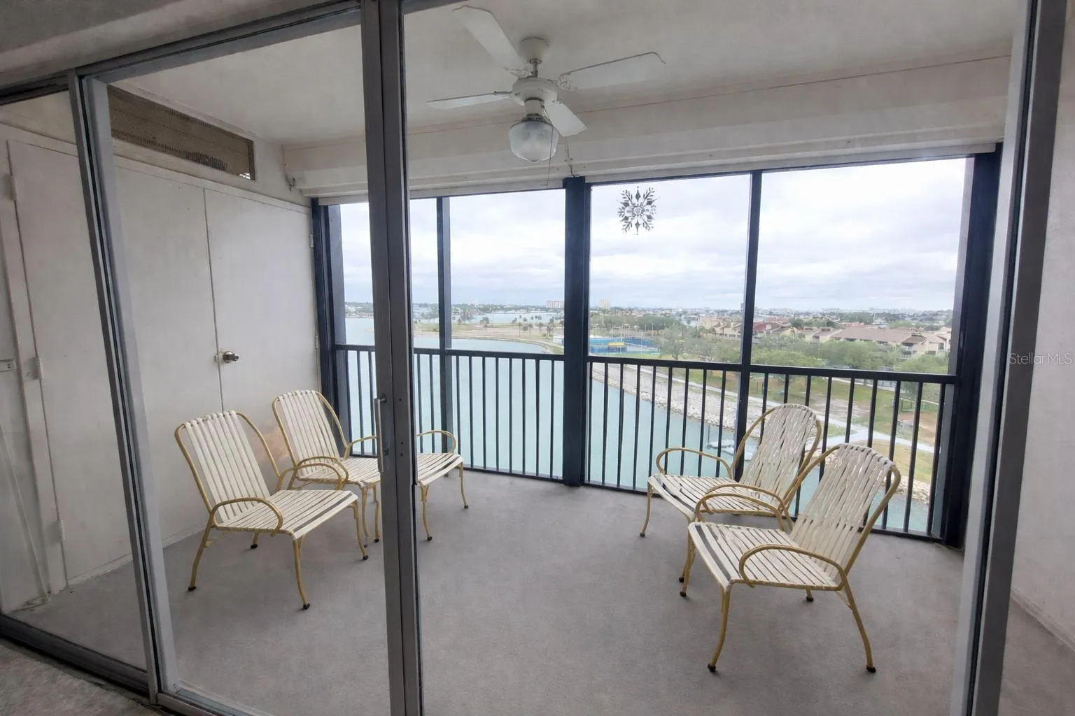 Screened balcony with electric hurricane shutters