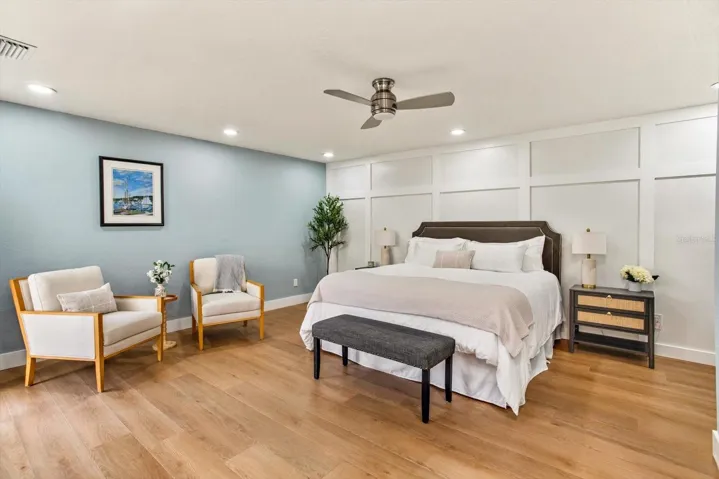 Primary bedroom with custom wall paneling