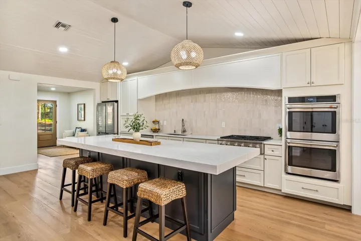 Quartz-topped island and double ovens