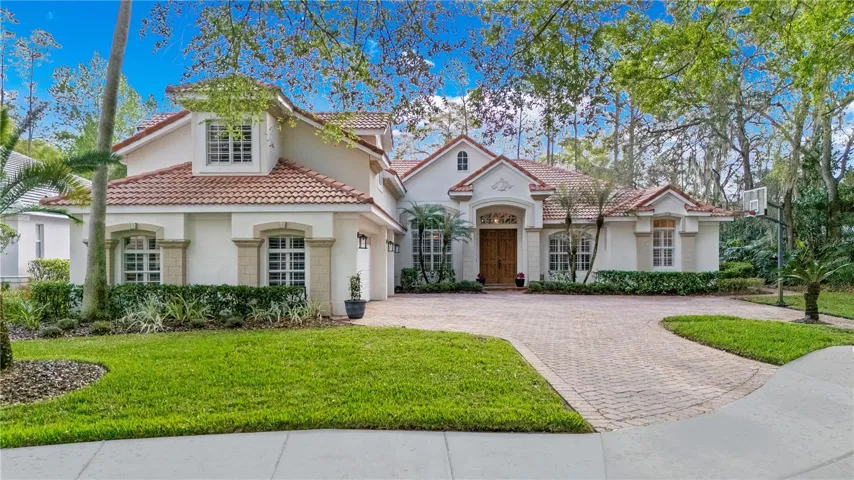 Beautiful exterior elevation and perfectly sited on a quiet cul de sac with a wooded view and easy access to community amenities.