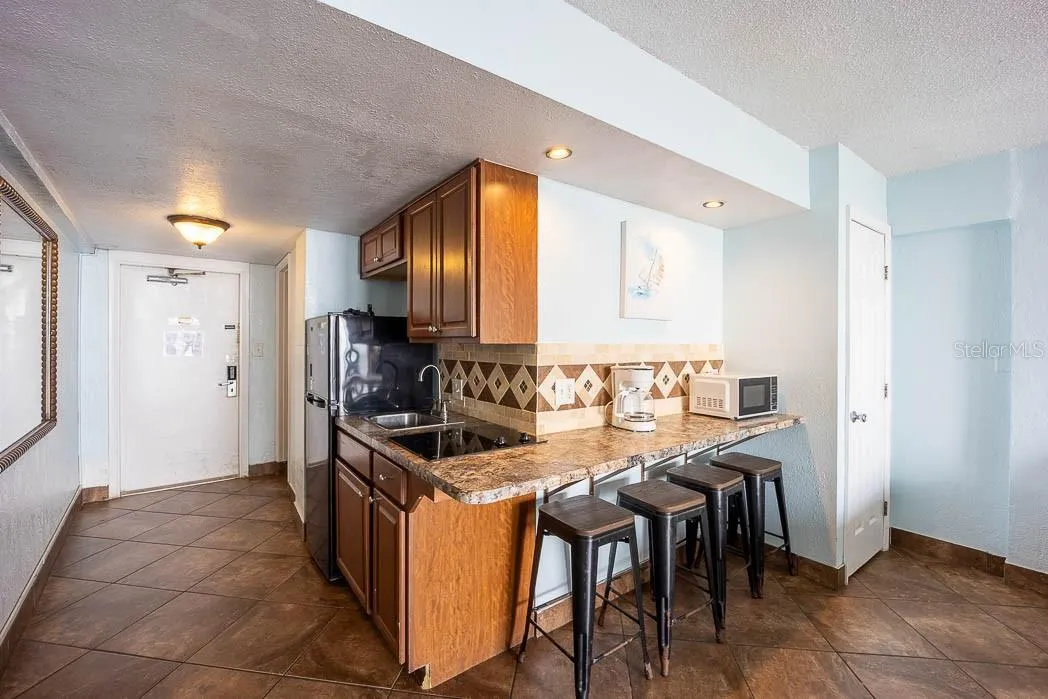 Kitchenette with Full-size refrigerator and Breakfast Bar