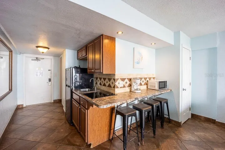 Kitchenette with Full-size refrigerator and Breakfast Bar