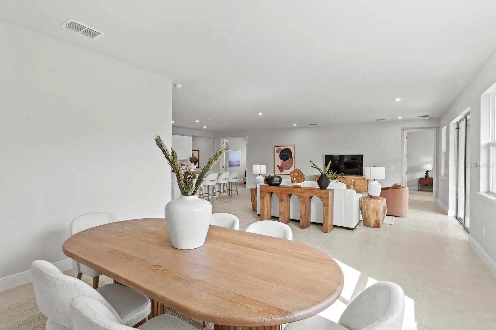 Staged Dining with Living Room View