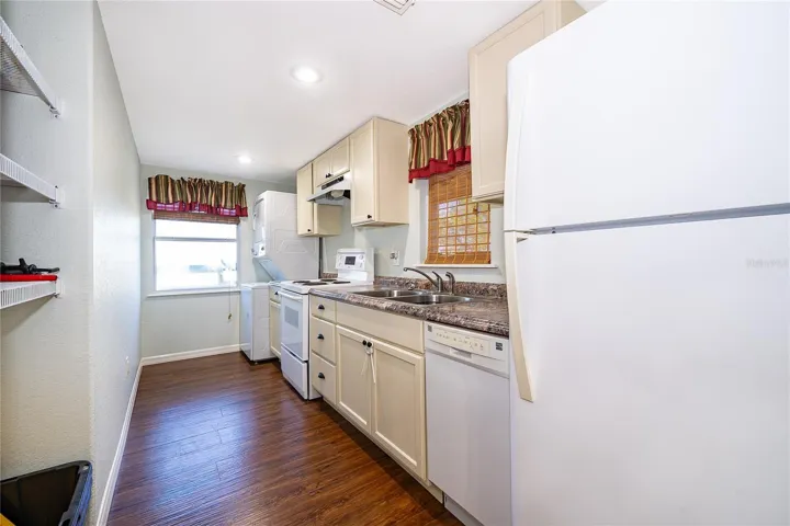 Apartment Kitchen with Washer / Dryer combo.