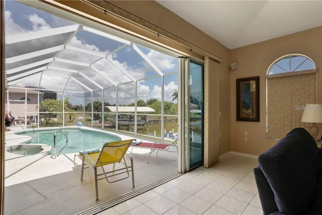 Pool view from family room - four glass sliders to open up to enjoy the weather