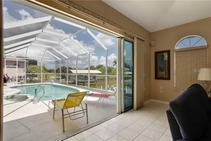 Pool view from family room - four glass sliders to open up to enjoy the weather